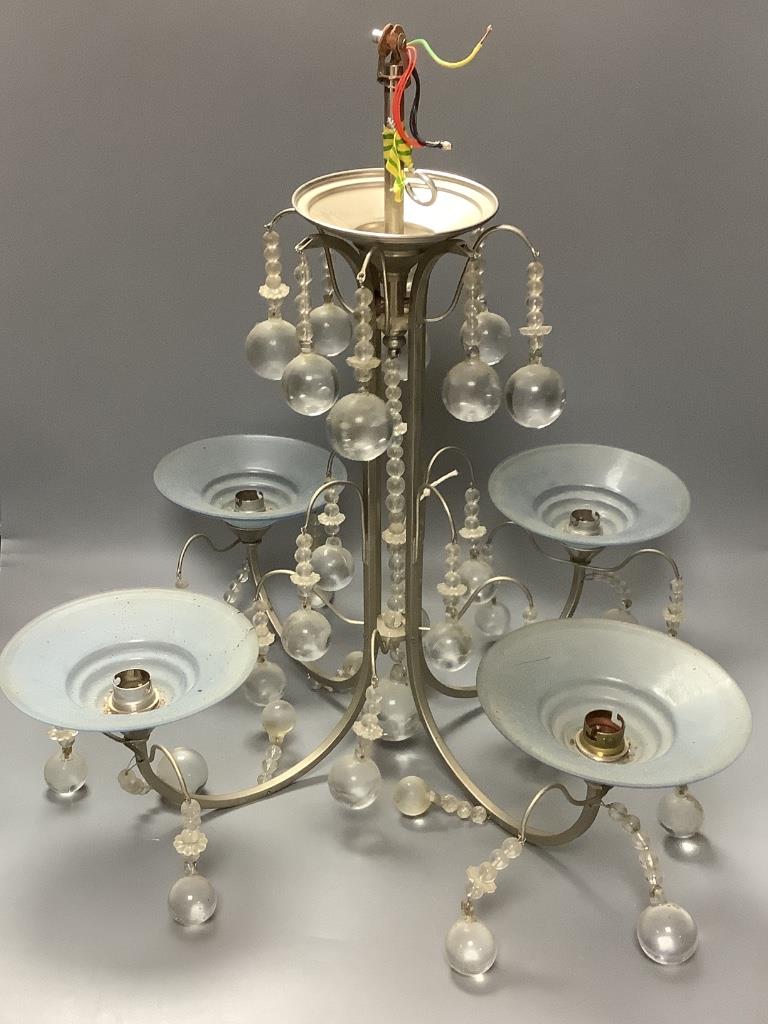 A four-branch ceiling pendant fitted inverted conical shades and spherical drops H 57.5cm Dia 57.5cm